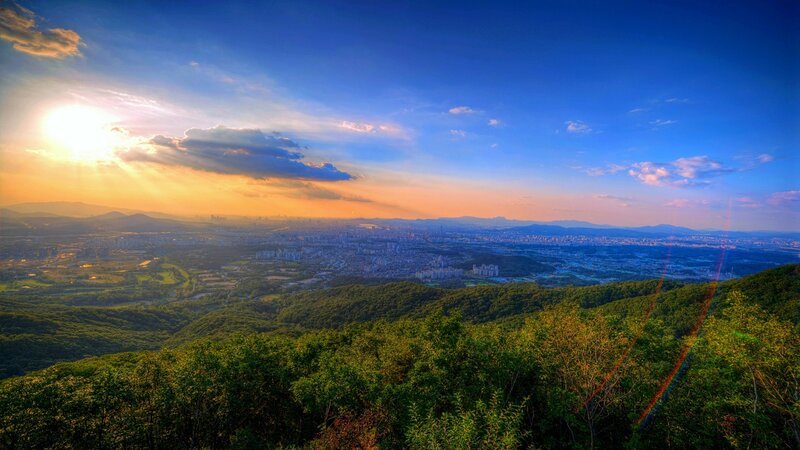 Sunset over city from mountain