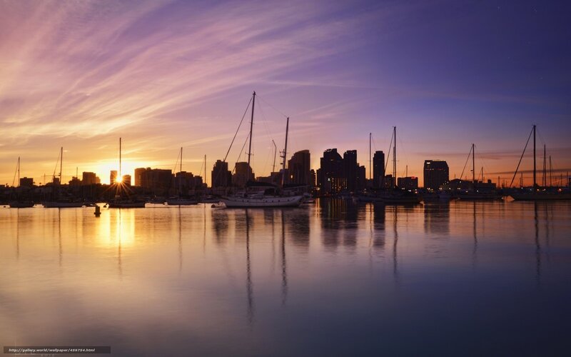 sunset over city harbor