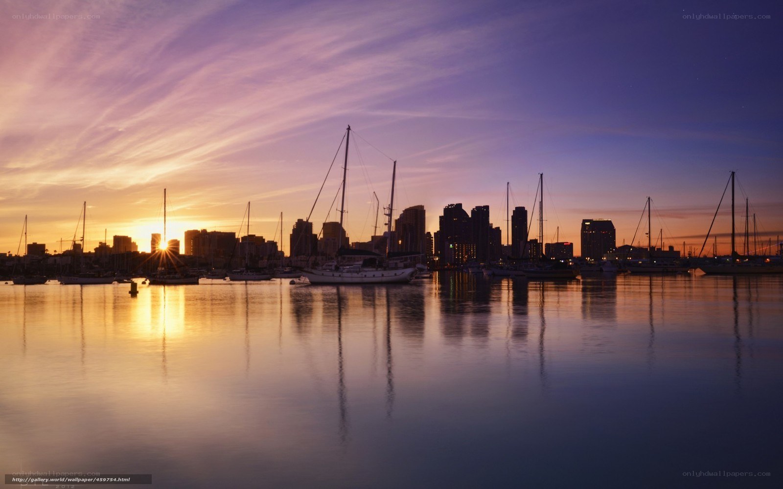 sunset over city harbor