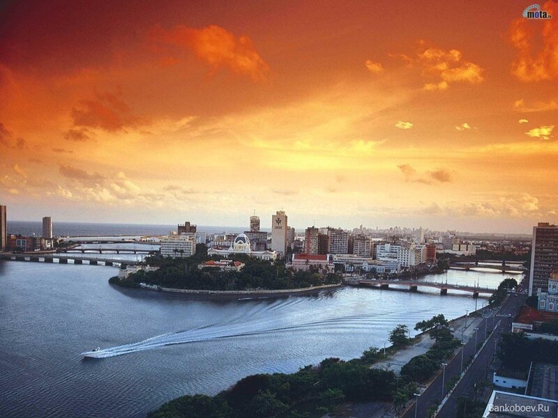 sunset over city harbor