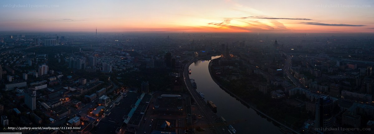 Sunset over city river