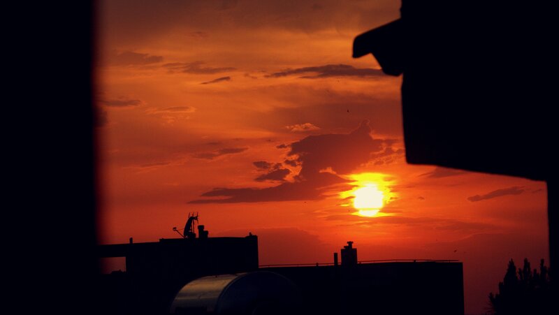 sunset over city rooftops