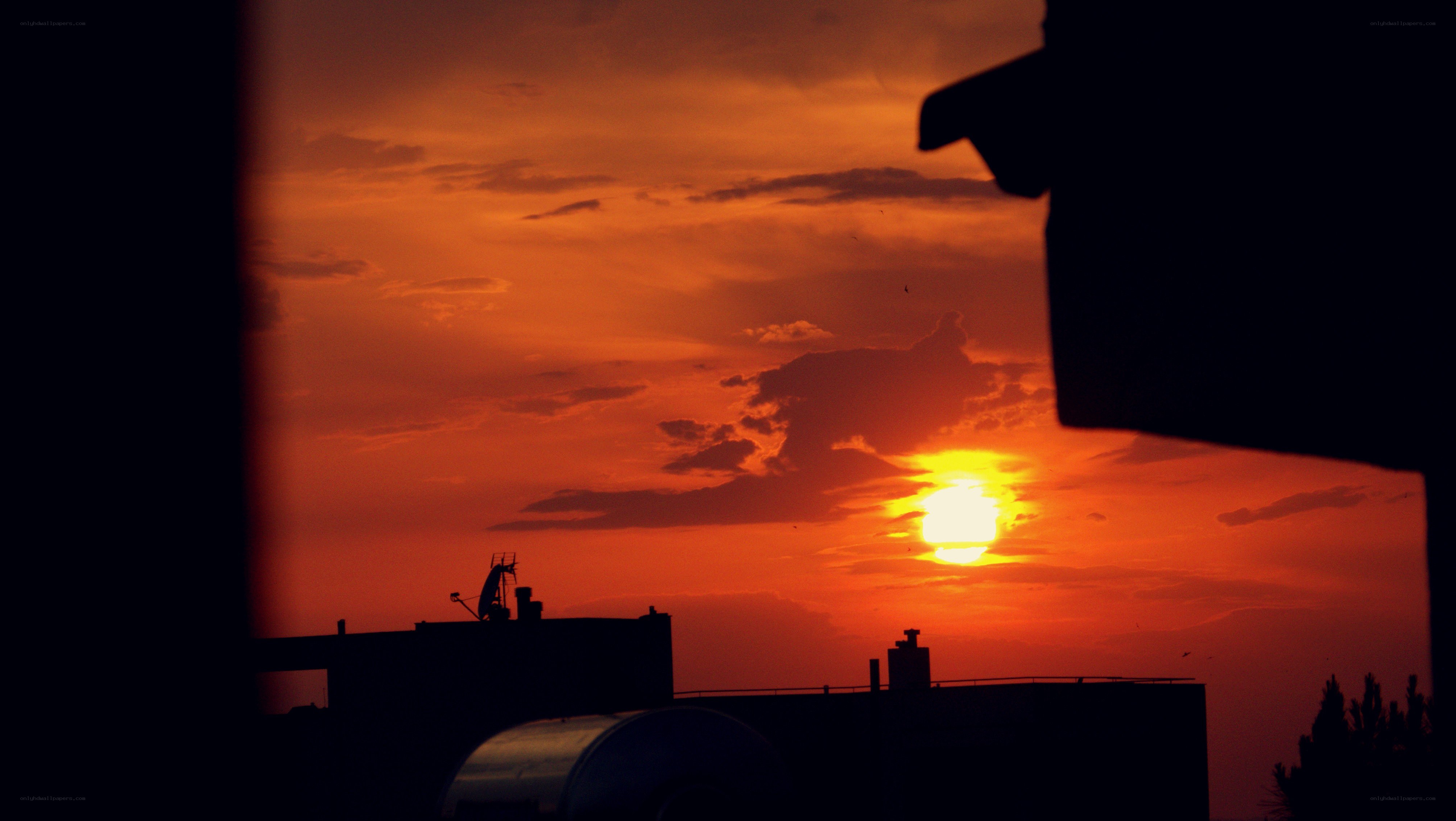 sunset over city rooftops
