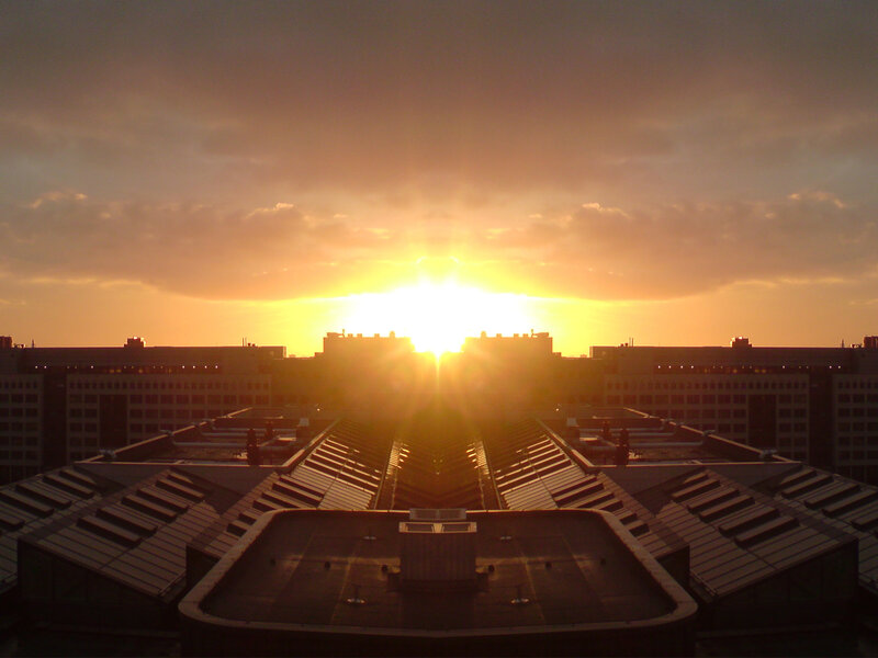 Sunset over city rooftops