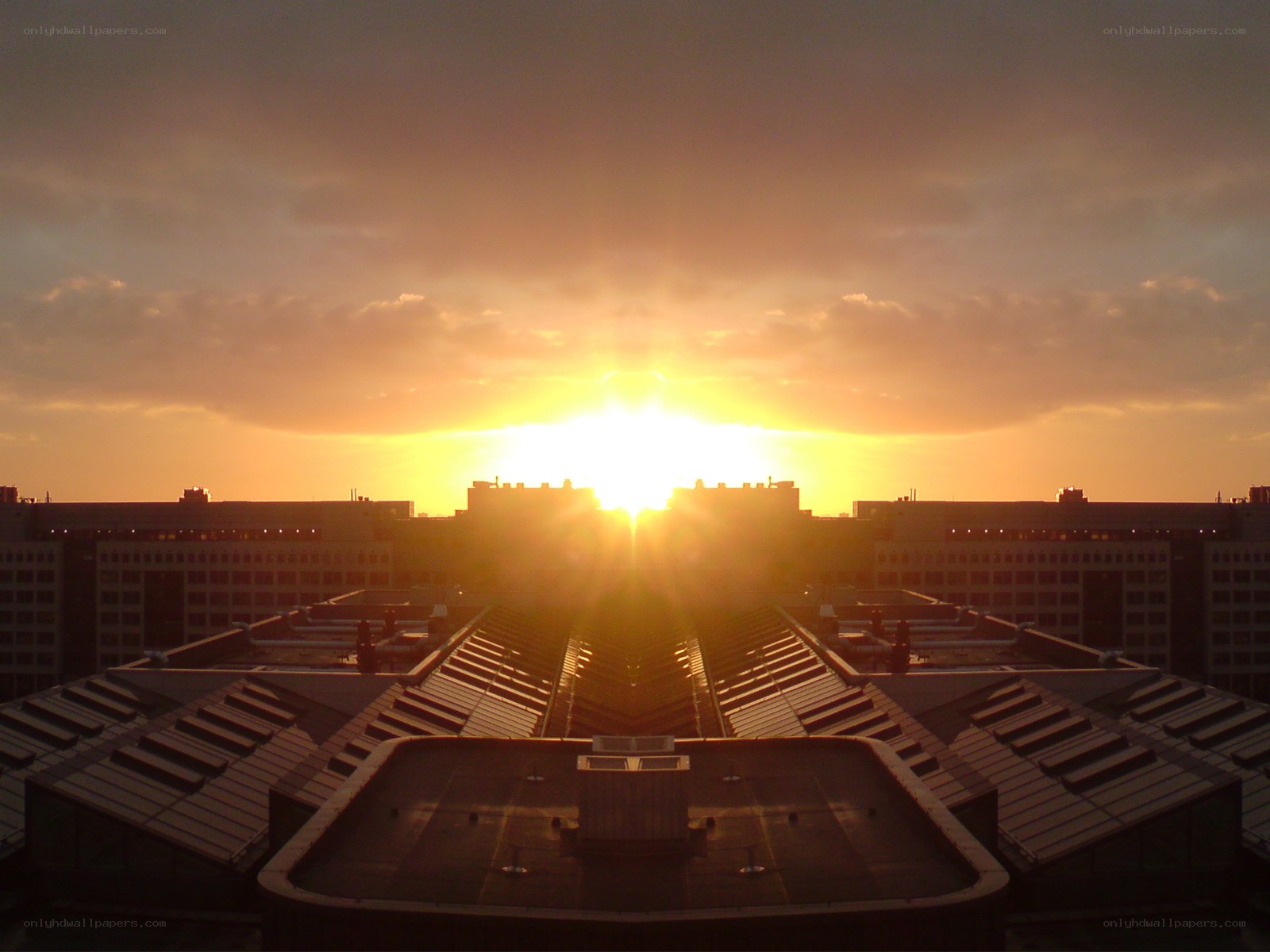 Sunset over city rooftops