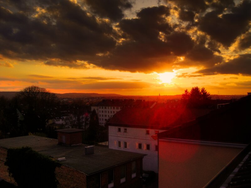 Sunset over City Rooftops — Orange, Dramatic