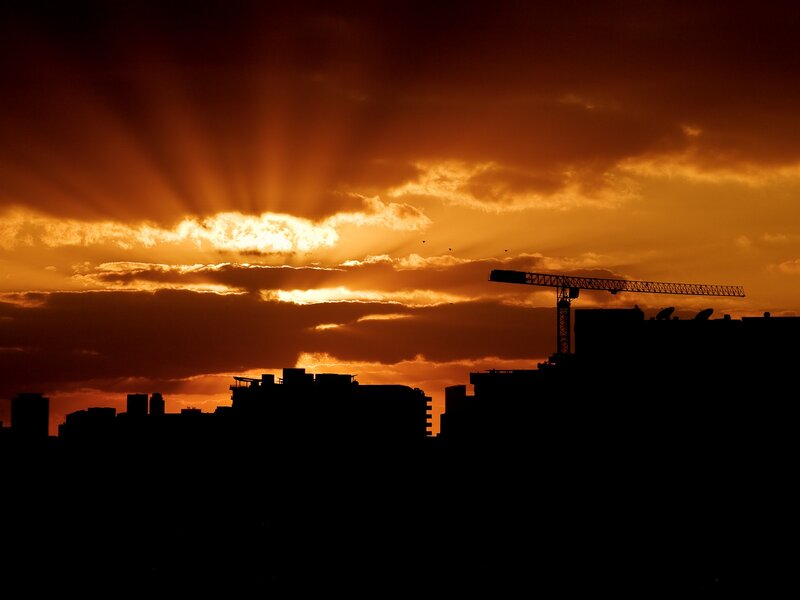 Sunset over city silhouette