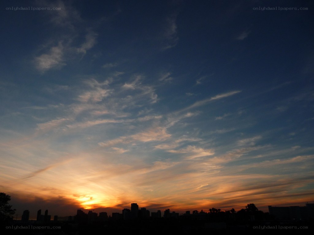 sunset over city skyline