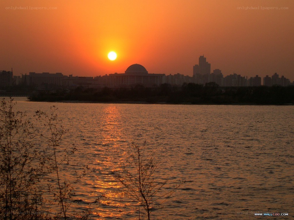 Sunset over city skyline