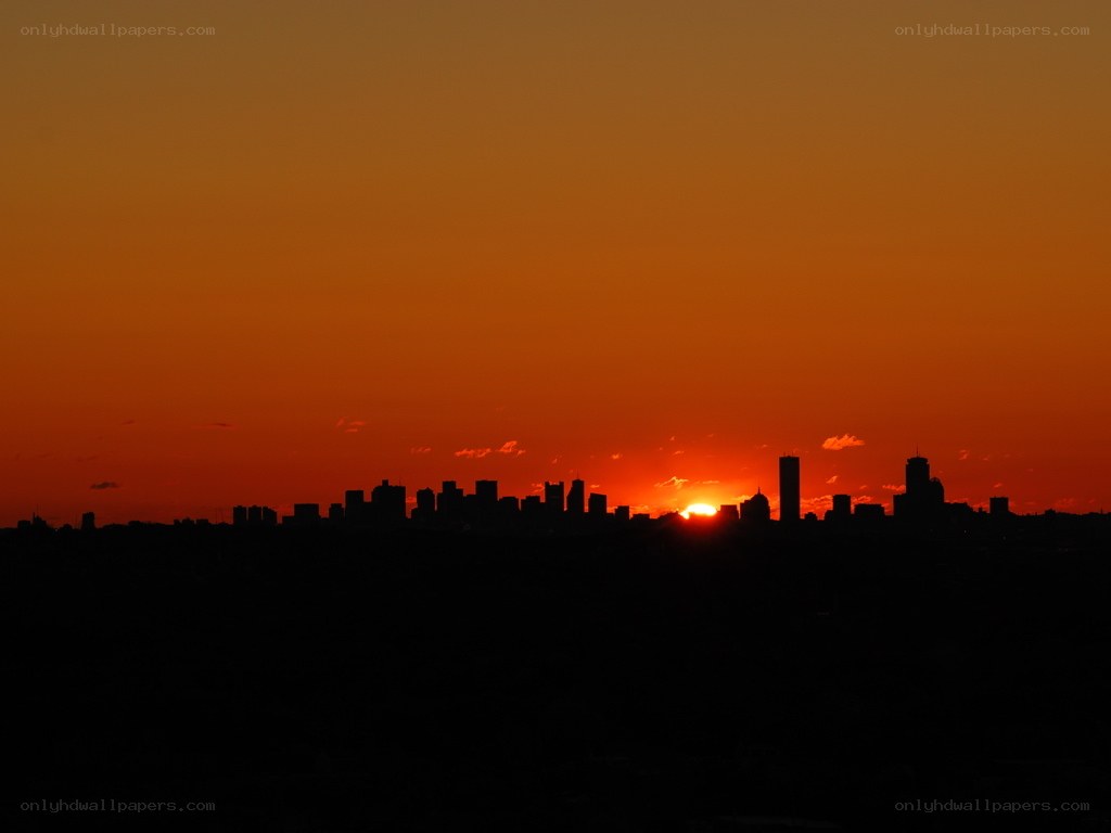sunset over city skyline
