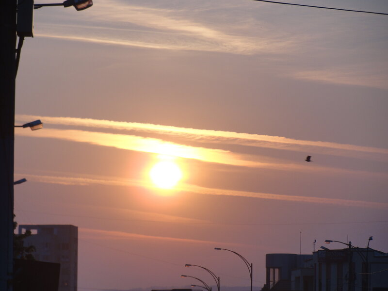 Sunset over city skyline