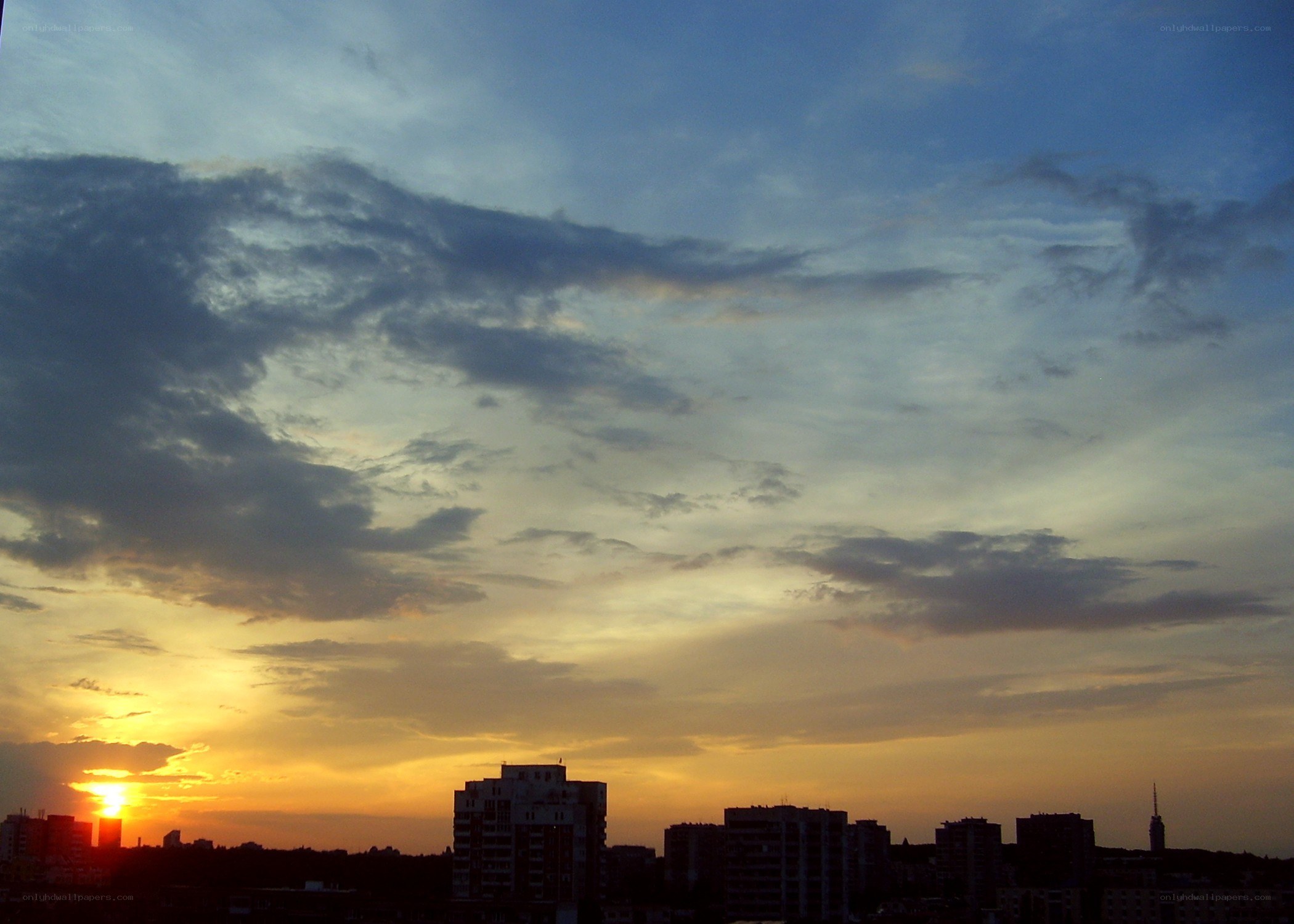 Sunset over city skyline