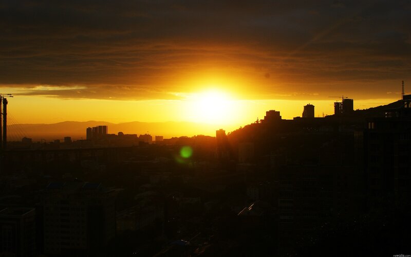 Sunset over city skyline