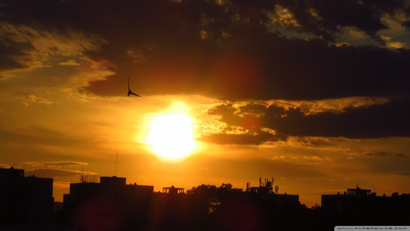 Sunset over city skyline