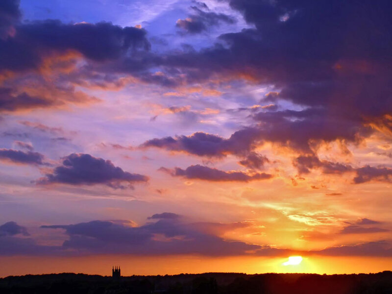 Sunset over City Skyline — Orange, Dramatic, Photograph, Clouds, Sun, Trees