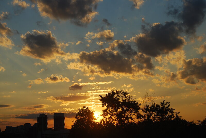 Sunset over City Skyline — Orange, Dramatic, Photograph, Clouds