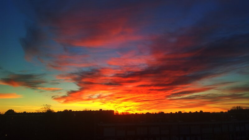 Sunset over City Skyline — Red