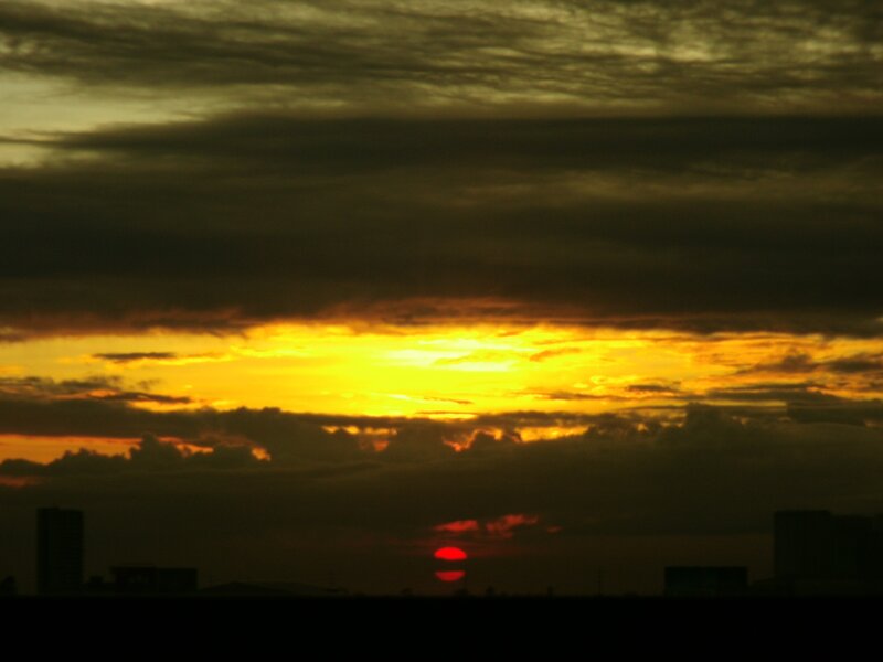 Sunset over City Skyline — Yellow