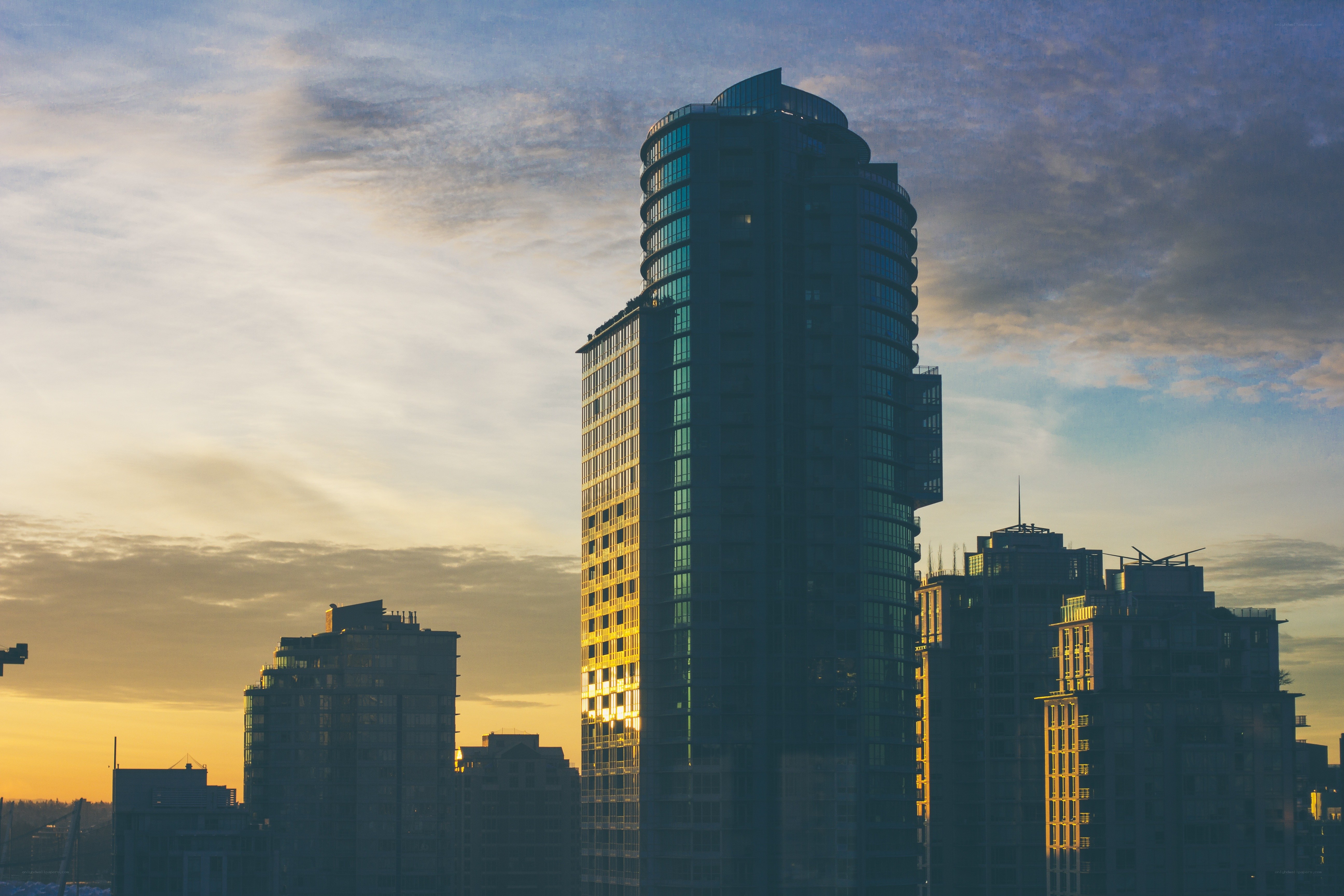 Sunset over city skyscrapers