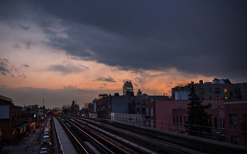 Sunset over city train tracks