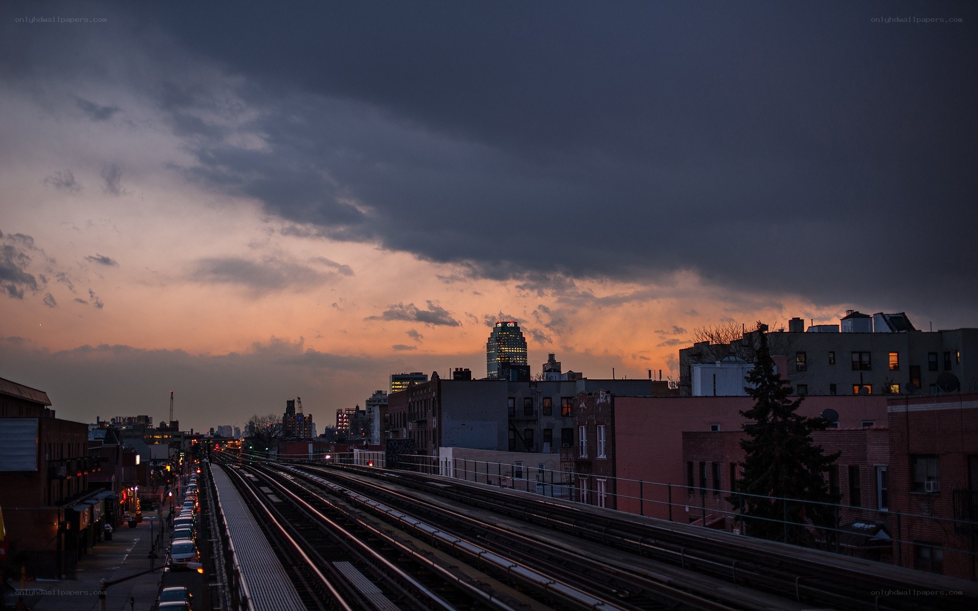 Sunset over city train tracks