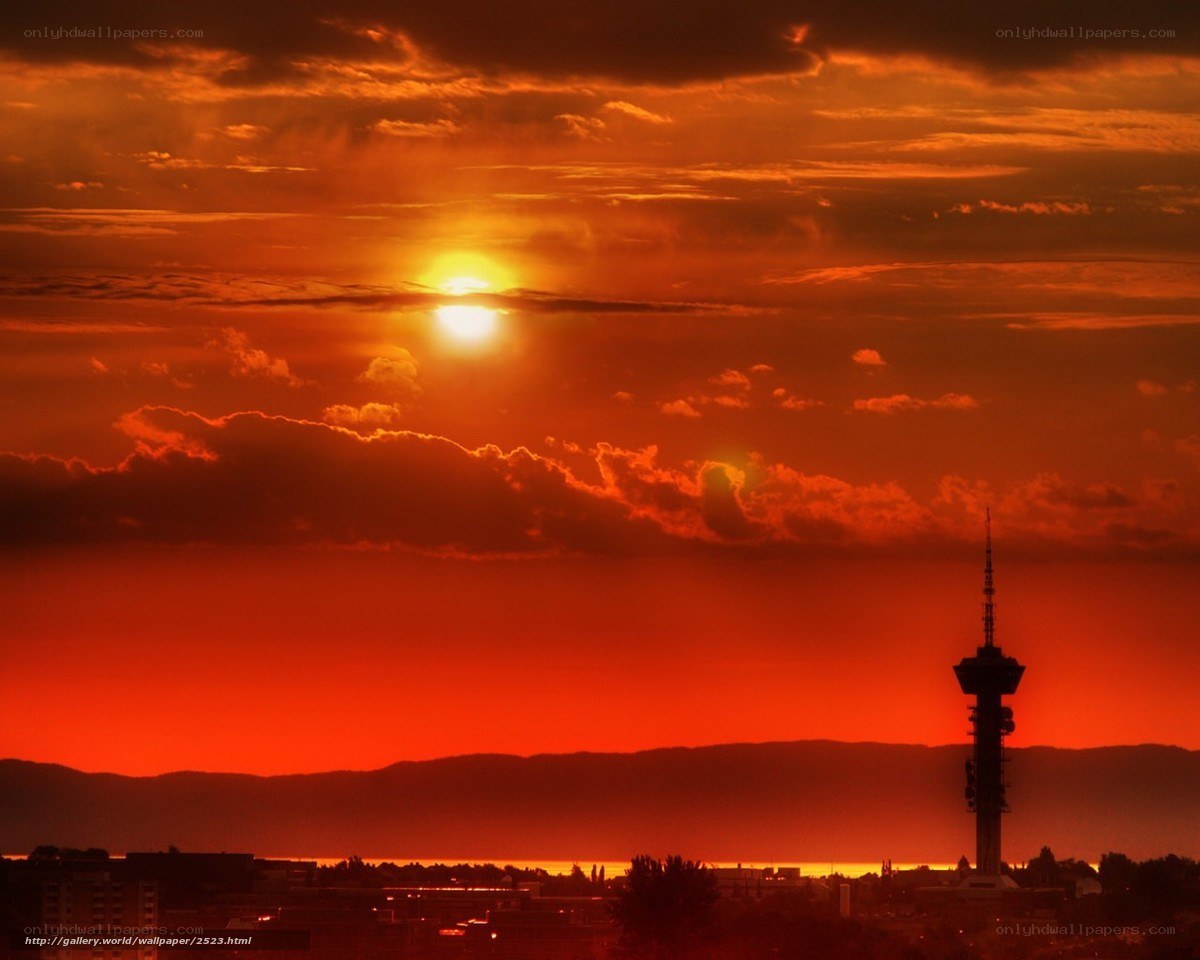 Sunset over city with tower