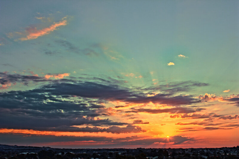 Sunset over Cityscape — Orange, Dramatic, Photograph, Clouds