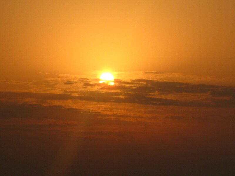 Sunset over clouds