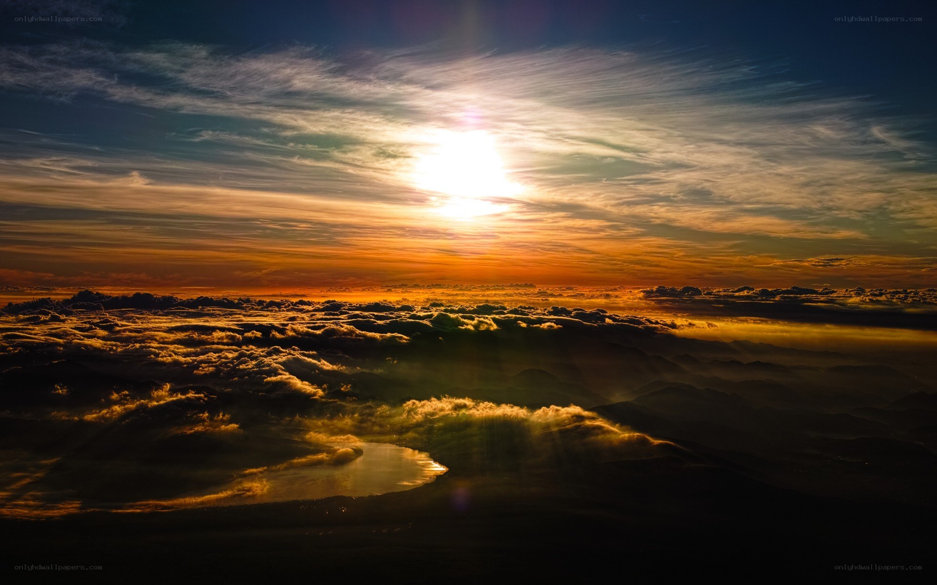 Sunset over clouds and mountains