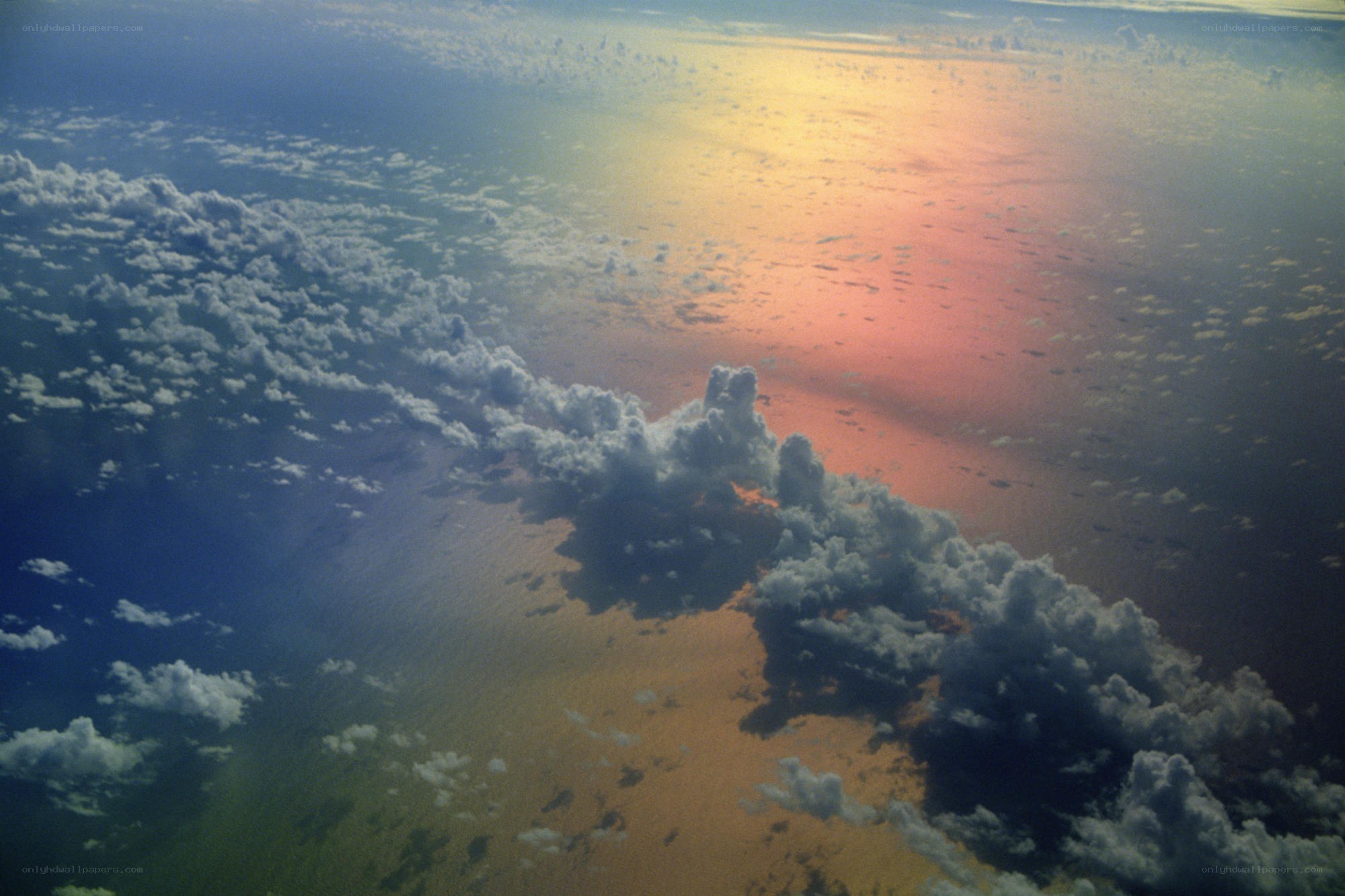 Sunset over clouds from above