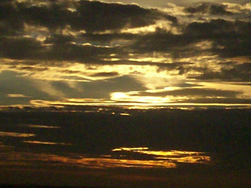 Sunset over Clouds — Gold