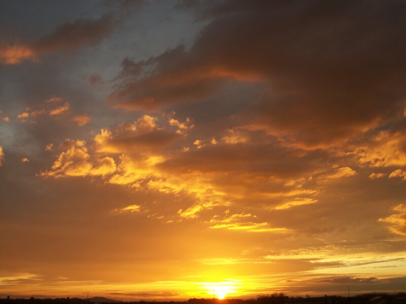 Sunset over Clouds — Orange, Dramatic