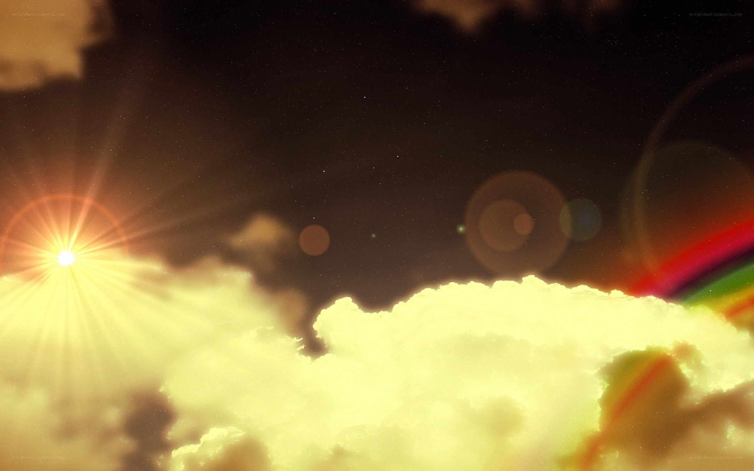 sunset over clouds with rainbow