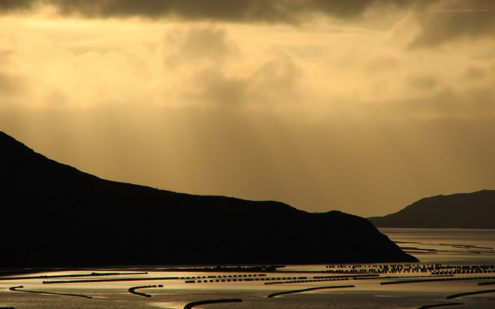 Sunset over coastal aquaculture