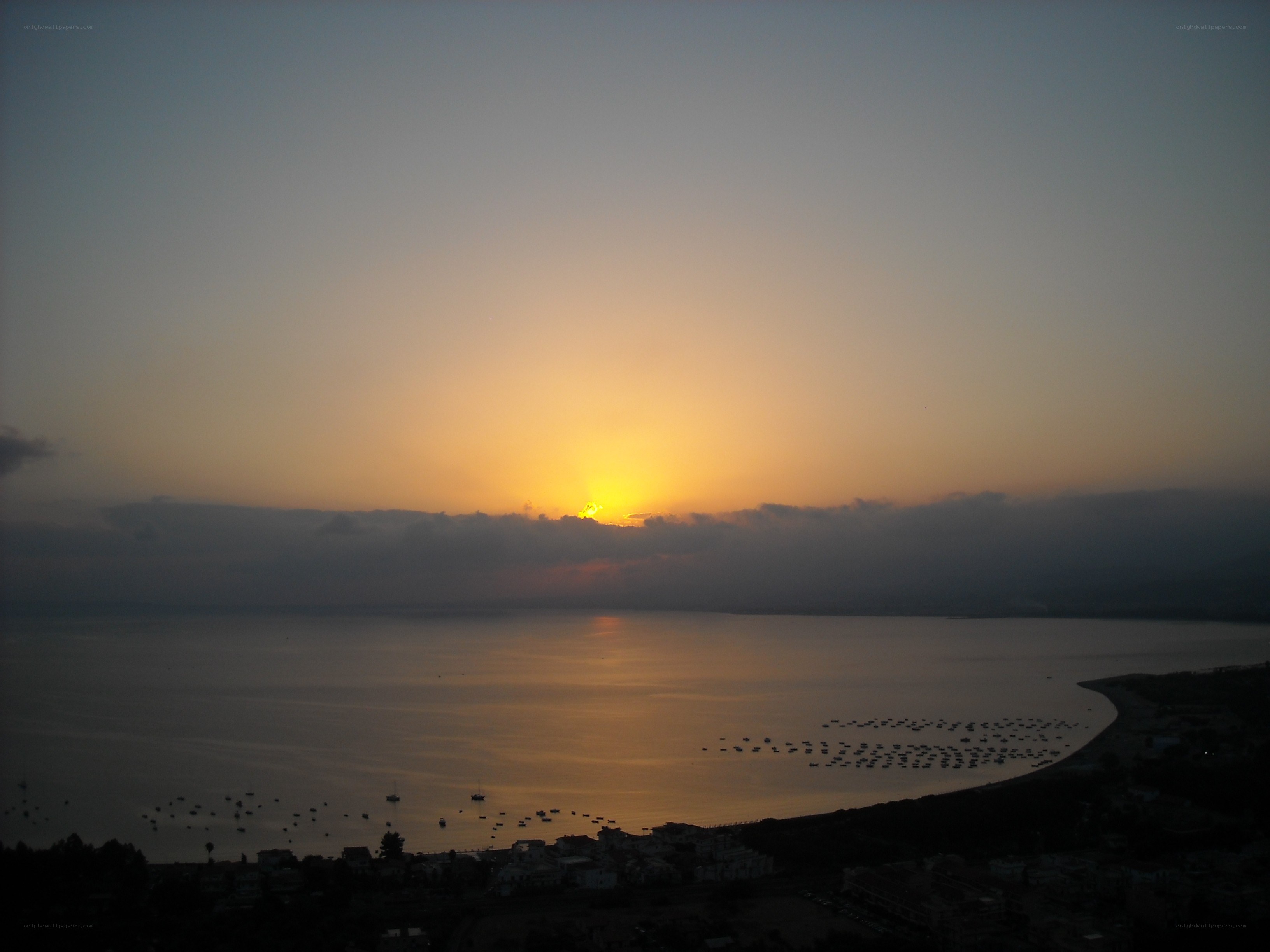 sunset over coastal bay