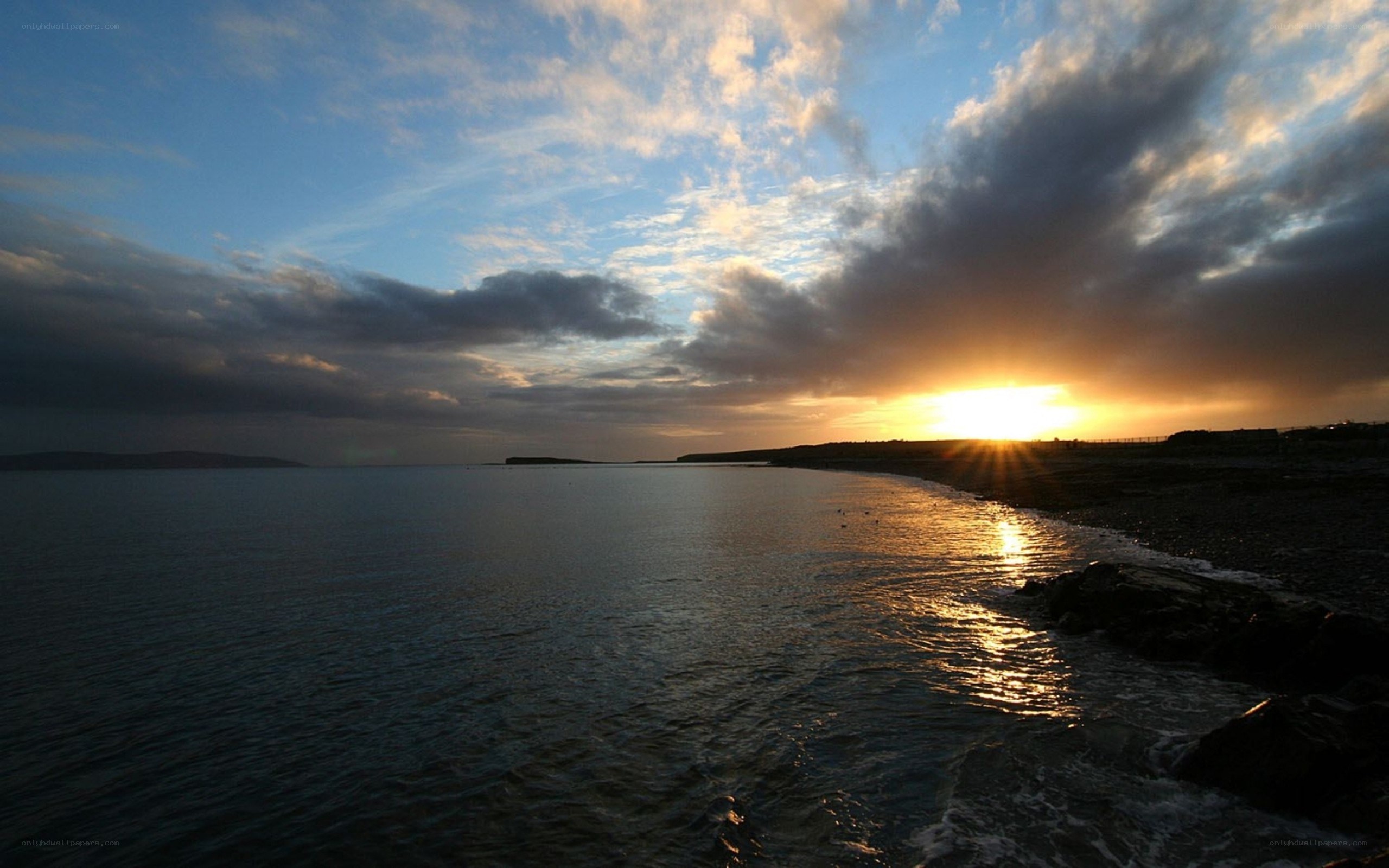 sunset over coastal bay