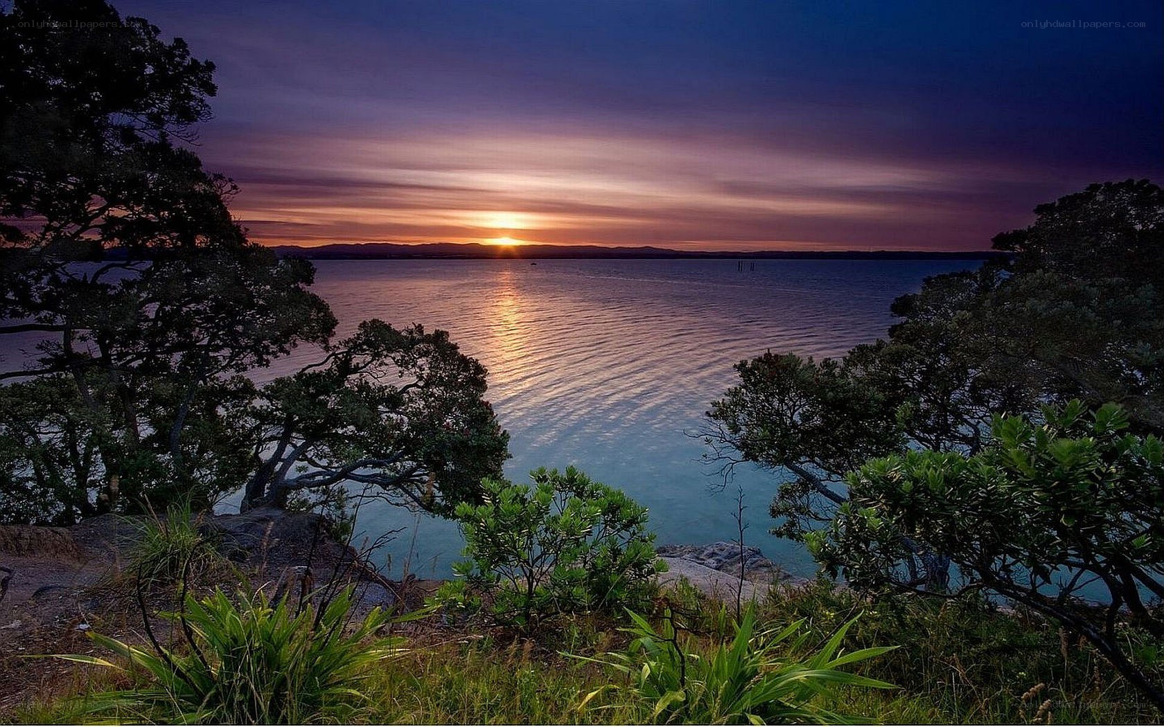 sunset over coastal bay
