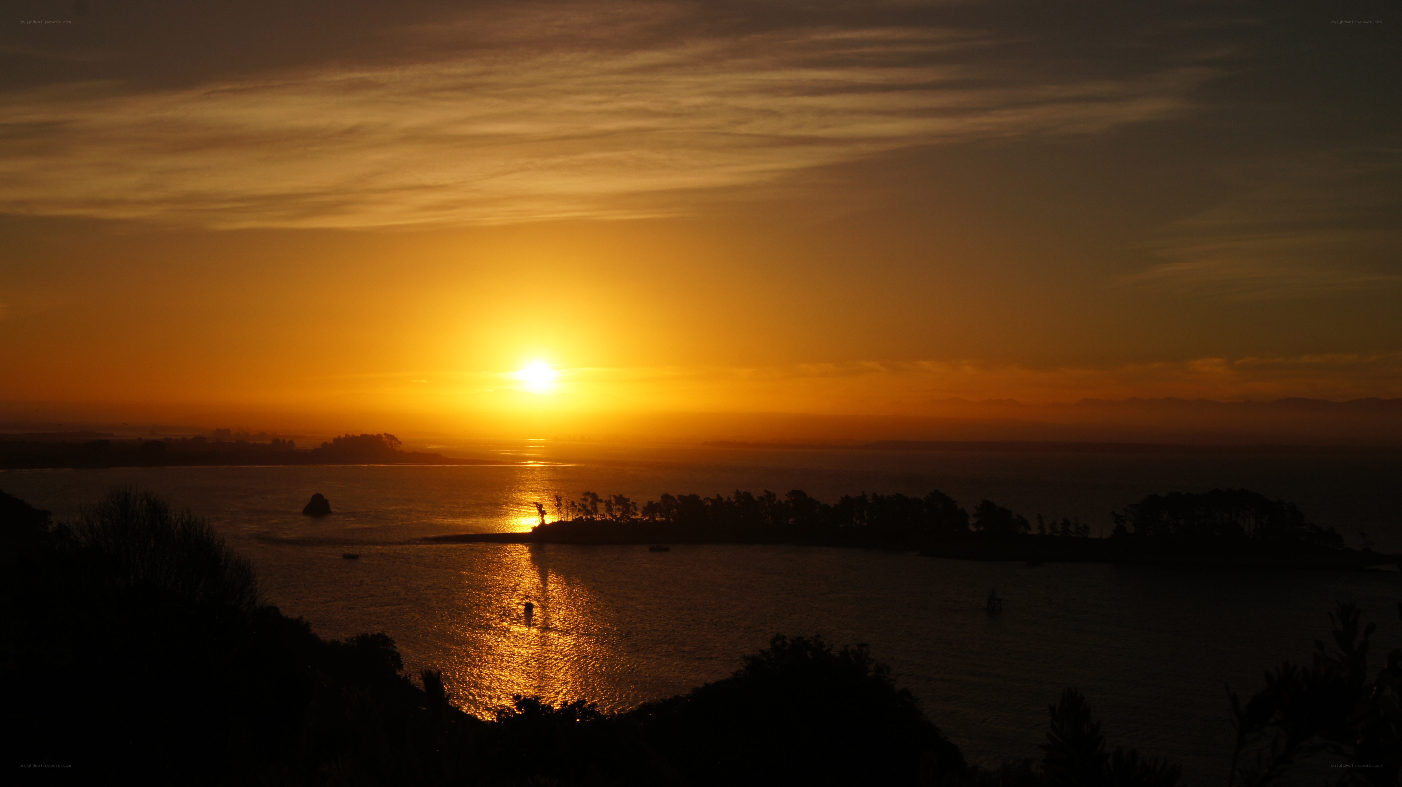 sunset over coastal bay