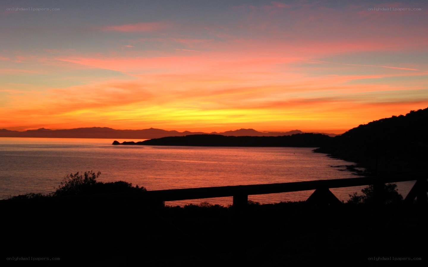 sunset over coastal bay