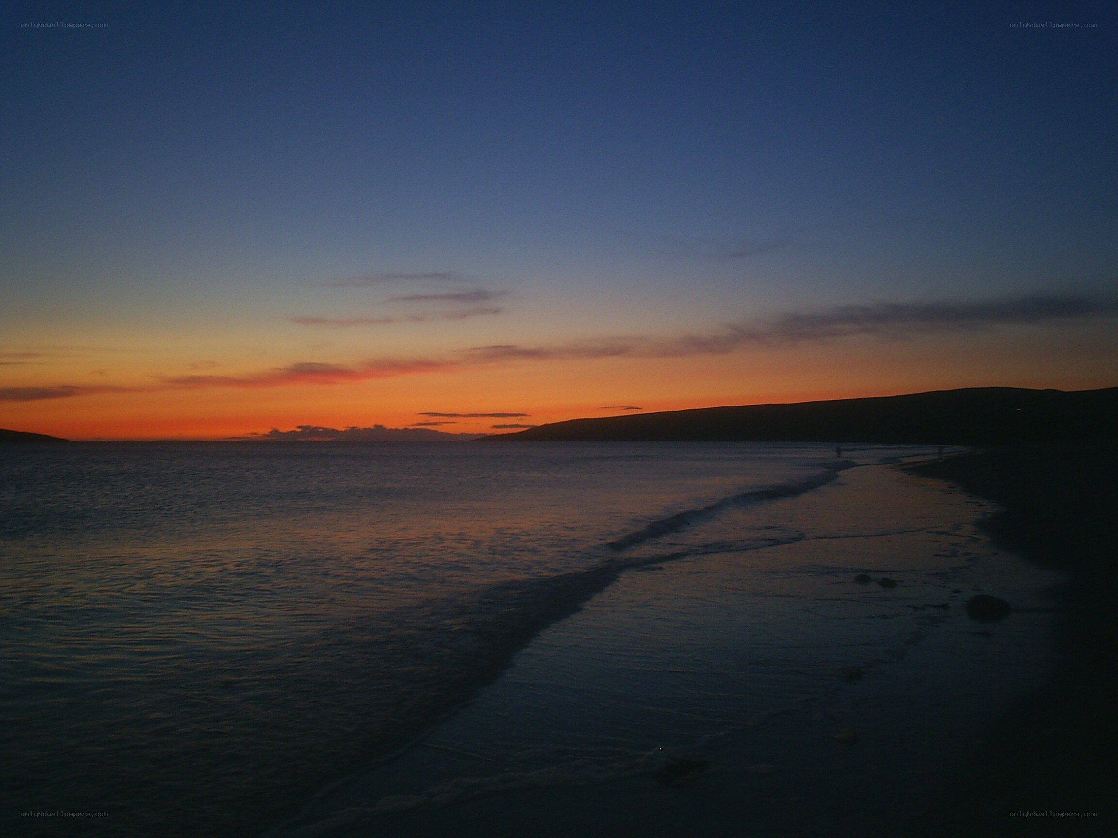 sunset over coastal bay