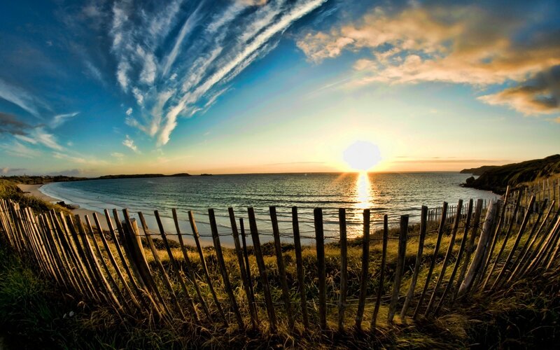 Sunset over Coastal Bay — Blue, Serene, Photograph, Fence