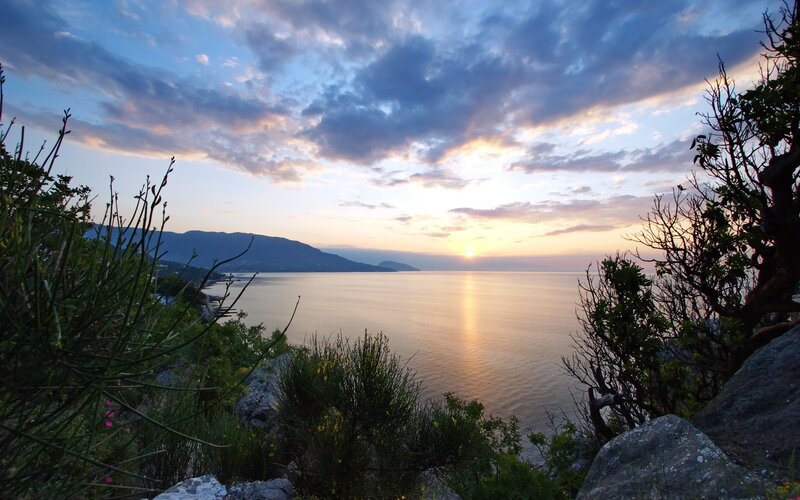Sunset over Coastal Bay — Blue, Serene, Photograph, Mountains, Sea, Clouds