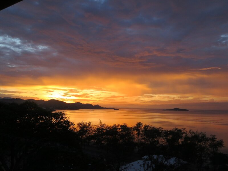 Sunset over Coastal Bay — Orange, Dramatic, Photograph, Mountains