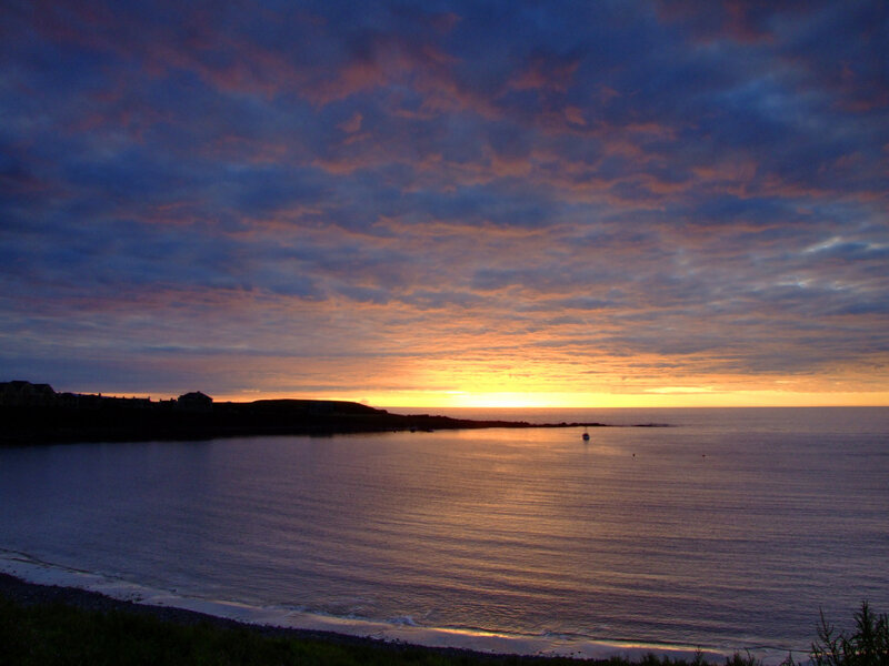 Sunset over Coastal Bay — Orange, Serene, Photograph, Sky