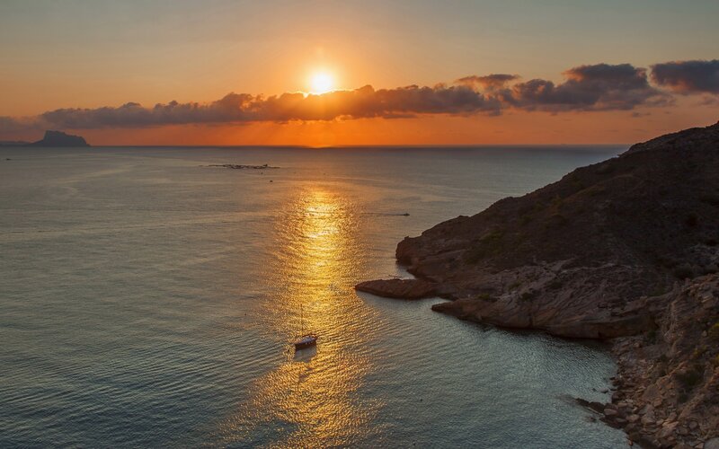 Sunset over Coastal Bay — Orange, Serene, Photograph, Sun