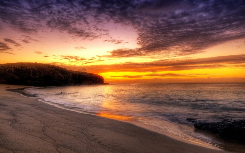 sunset over coastal beach