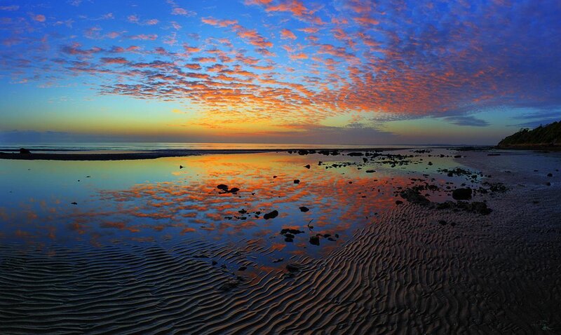 sunset over coastal beach