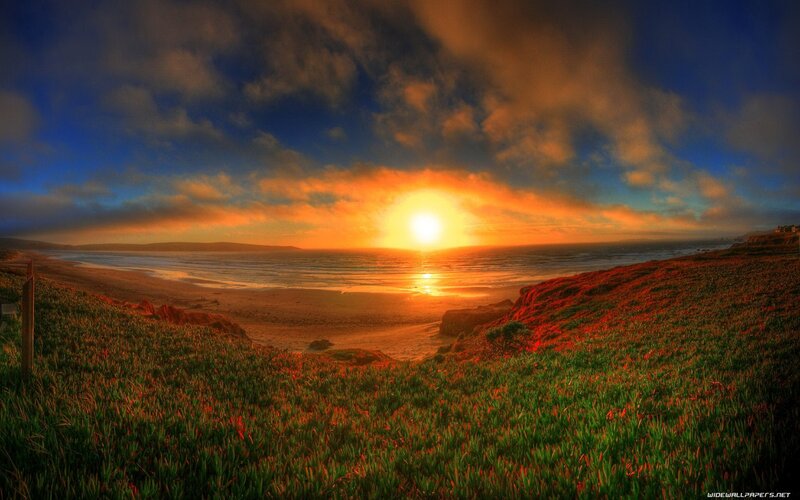 Sunset over Coastal Beach — Orange, Dramatic, Photograph