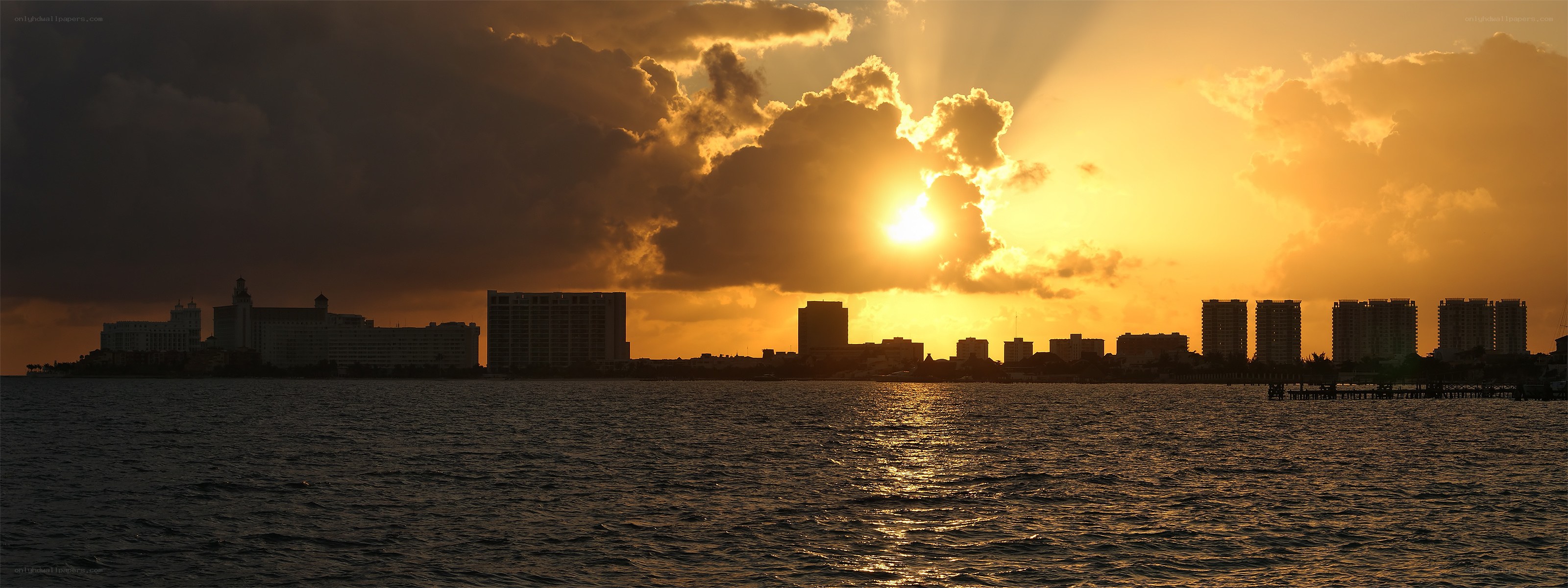 sunset over coastal city