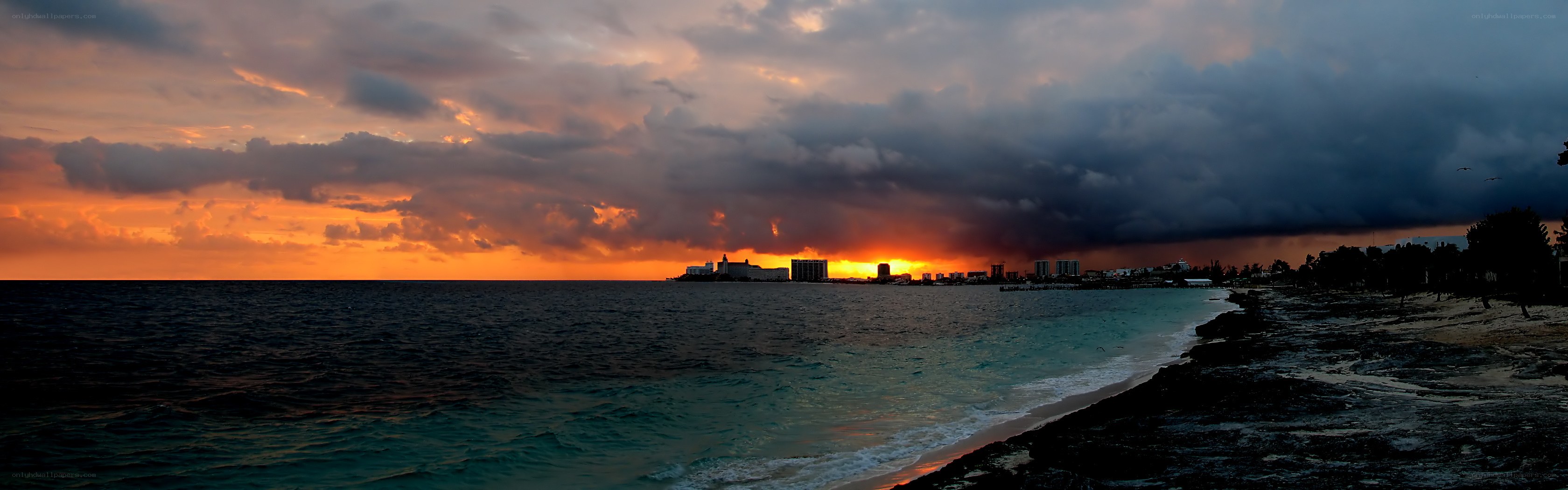 sunset over coastal city